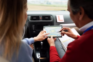 A learner driver practicing with an IPS Driving School instructor in Glasgow, offering manual and automatic driving lessons across multiple areas.